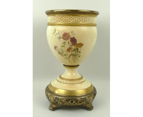A Royal Worcester blush porcelain oil lamp base, early 20th century, painted with meadow flowers, raised on a pierced brass c