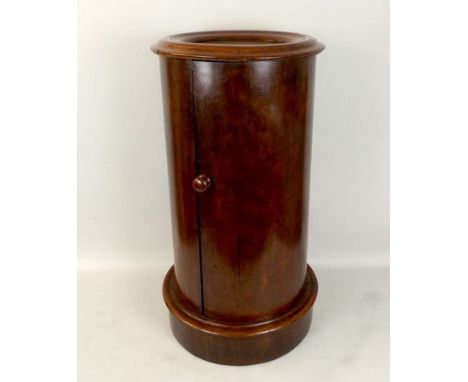 A Victorian mahogany pedestal pot cupboard, of cylindrical form, with single cupboard door revealing an interior shelf, 40 by