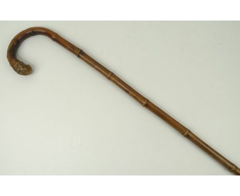 A 19th century bamboo sword stick, with root ball and crook handle, 88cm long. 