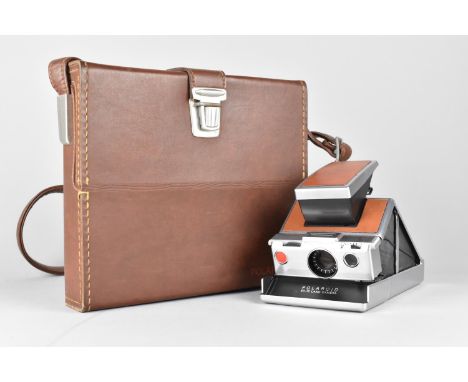 A Polaroid Land Camera Outfit in Fitted Leather Case, Polaroid Tripod Mount, Various Other Accessories, Lenses and Flash Diff