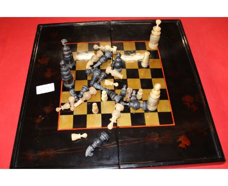 A vintage lacquered  chess board &amp; pieces (complete) 