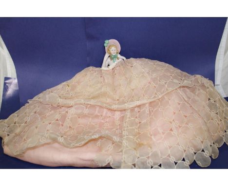 A vintage ceramic half doll figure 