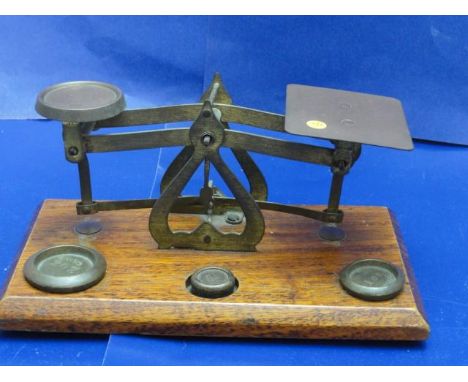 A set of Edwardian postal scales complete with weights 
