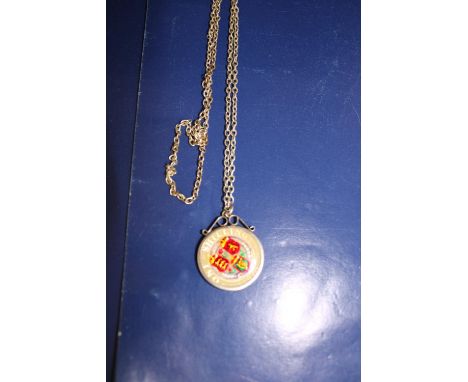 A collectable silver &amp; enamel coin &amp; chain 