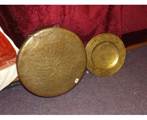 BRASS  DINNER GONG & HEAVY POLISHED ASIAN BRONZE WALL CHARGER  WITH A CENTRAL  SERPENT DECORATION