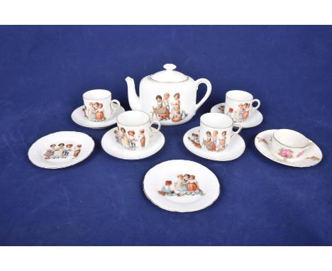 A doll's tea service - incomplete
Decorated with children playing.