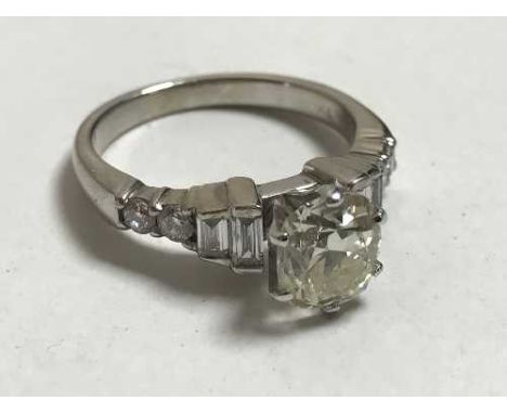 A large solitaire diamond ring in 18ct white gold, the cushion shaped old cut stone approximately 1.7ct, very clean, the shou