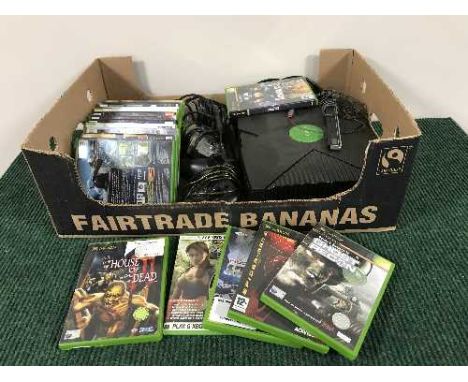 A box of XBox console with controllers and quantity of games 