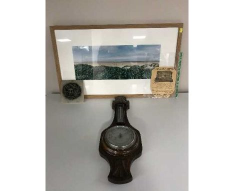 A pine framed print of St Annes, a Green Man wall plaque and a carved oak barometer