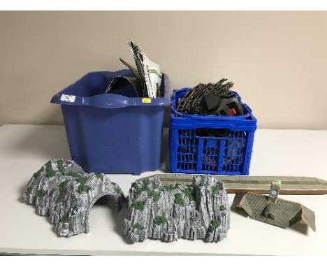 Two boxes of model train track, power units and accessories 