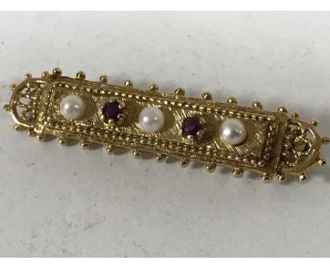 A 9ct gold ruby and seed pearl set bar brooch