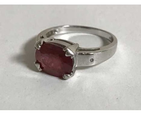 An 18ct white gold ring set with a large ruby 