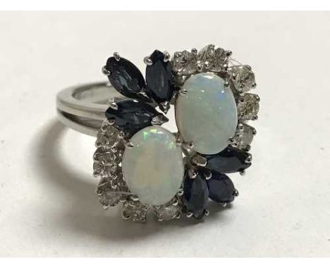 An 18ct white gold opal diamond and sapphire ring