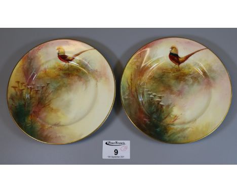 Pair of Royal Worcester porcelain side plates hand painted with pheasants amongst foliage, signed Bedgley. Puce printed marks