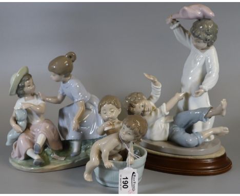 Two Spanish Nao porcelain figure groups of young children in play, together with a Lladro Spanish porcelain figurine of two n