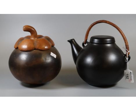 Finnish 'Arabia' black ground pottery lidded teapot with wicker handle, together with an unusual art pottery lidded jar and c