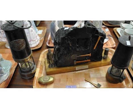Tray containing a large decorative piece of coal with a plaque reading: 'Mined in Cynheidre, 1985', adorned with miniature wo