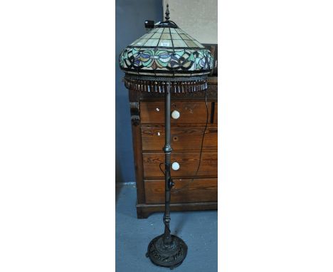 Tiffany style standard lamp, the multi-coloured floral shade with amber coloured glass droplets on a metal and pierced circul