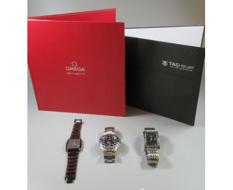 Omega The Collection book, together with a similar Tag Heuer book,together with a shoe box of assorted watches to include Tim