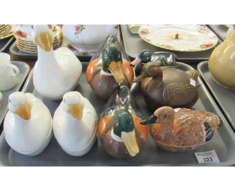 Two trays of assorted animal shaped items to include; various china egg crocks in the shape of birds to include; geese, ducks