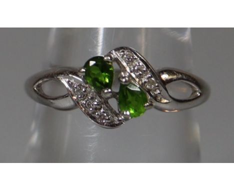 9ct white gold set with two pear shaped green gemstones and diamonds.  Ring size M.  Approx weight 2.7 grams.(B.P. 21% + VAT)
