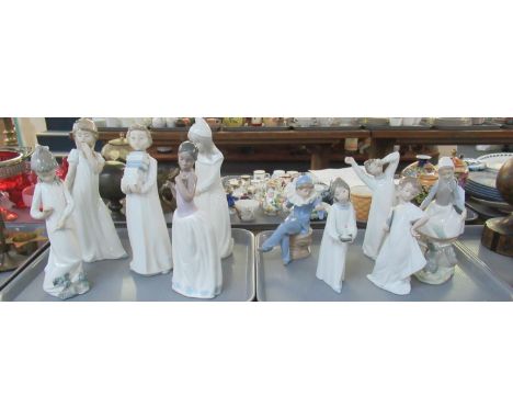 Two trays of assorted Spanish porcelain figurines to include; Nao and Lladro; three Lladro to include; girl with candle, girl