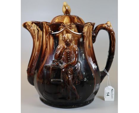 Large brown ground treacle glazed pottery lidded water jug or teapot with moulded decoration of Shakespeare, unmarked. (B.P. 