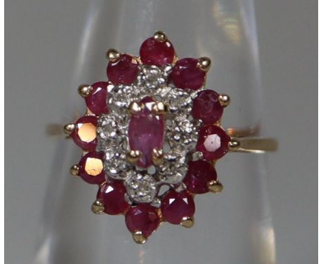 9ct gold ruby and diamond oval cluster ring.  Ring size I.  Approx weight 2.2 grams.(B.P. 21% + VAT) 
