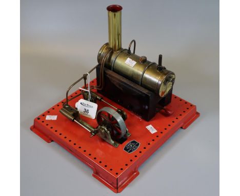 Griffin & George Ltd. working live steam stationary engine on square base. Spirit fired.(B.P. 21% + VAT) Generally worn overa