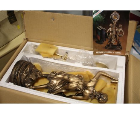 A BOXED MODERN FIGURATIVE MANTEL CLOCK