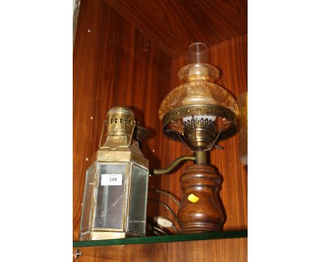 A REPRODUCTION BRASS AND TREEN TABLE LAMP TOGETHER WITH A TWO BRANCH CANDLE STAND, VINTAGE BRASS CANDLE LANTERN