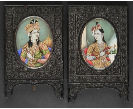 *Anglo-Indian School. Mughal Empresses, circa 1800,  a pair of oval opaque watercolours with gold on ivory, each showing a fe