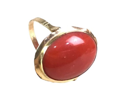 CORAL DRESS RING, EIGHTEEN CARAT GOLD set with a cabochon cut oval stoneQty: 2.76gRing size between Q and R, worn condition, 