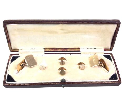 SET OF GOLD CUFFLINKS AND STUDS, NINE CARAT GOLD comprising a pair of cufflinks and a set of four studs, each with engine tur