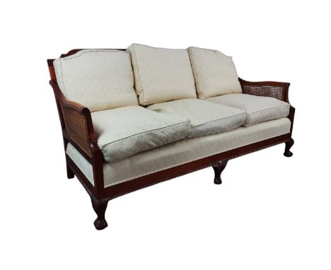 BERGERE THREE SEAT SOFA, ALONG WITH A TWO SEAT SOFA with upholstered cushions, cane back and sides, and ball and claw feetCan