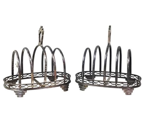 PAIR OF SILVER FIVE BAR TOAST RACKS, ALONG WITH A FURTHER SILVER TOAST RACK the pair of Art Deco form, with Birmingham marks,