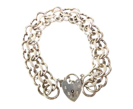 TWO SILVER BRACELETS AND A SILVER CHAIN, the bracelets formed with curb and round links and with padlock claspsQty: 60.39g gr