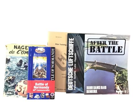 MILITARY INTEREST ITEMS, comprising of badges, a boxed Swiss Army knife, books, jacket buttons, and paper materials, along wi