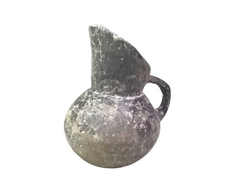 MEDIEVAL POTTERY JUG, ALONG WITH ANTONINUS PIUS COIN AND A MINIATURE BOW AND ARROW the jug in the Roman style, the bow and ar
