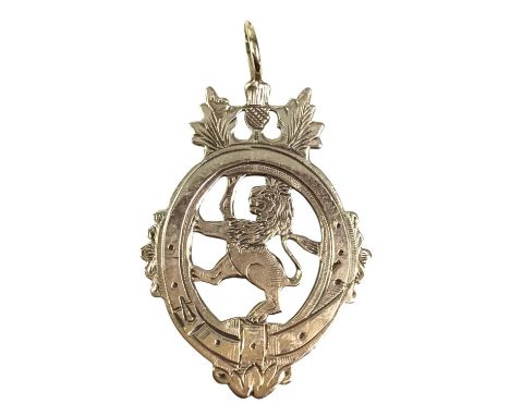 POCKET WATCH FOB MEDAL, depicting a Lion Rampant, with suspension loop and marked for nine carat gold4cm long including suspe
