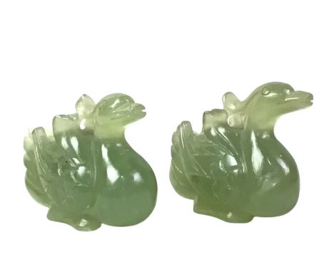 PAIR OF JADE SWAN FIGURES, LATE 20TH CENTURY carved jade in the form of swans, with flat feet detail to create a stable base,