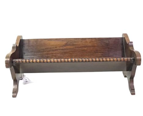 TWO BOOK TROUGHS, the first in mahogany with pierced quatrefoil ends, the second in oak with beaded bordersthe oak trough 38.