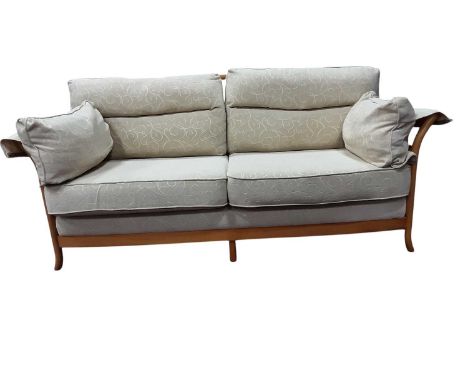 CONTEMPORARY THREE SEATER SOFA, with cream upholstery on a beech frame with turned spindle back and side200cm wide
