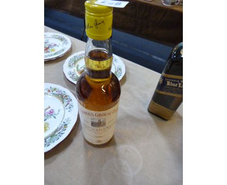 Bottle of Famous Grouse Scotch Whiskey