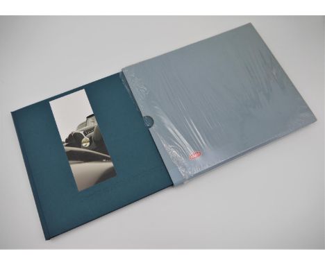 BUGATTI AUTOMOBILES: BUGATTI AT PEBBLE BEACH 2003  with numerous photographs, this book details the history of the meet toget
