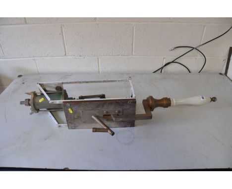 A CERAMIC AND BRASS HANDLED BEER PULL mounted on a painted steel and wood frame (no makers or brand name)