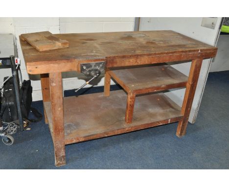 A PINE WORKSHOP BENCH fitted with a No55 vice (repaired) 150cm wide, 65cm deep and 88cm high and a stool with a fold out step