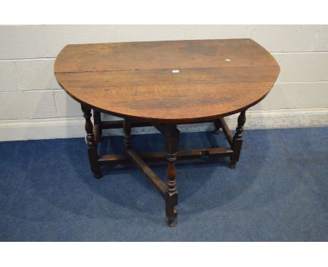 A GEORGIAN OAK GATE LEG TABLE, on turned legs, length 123cm x closed 52cm x height 72cm