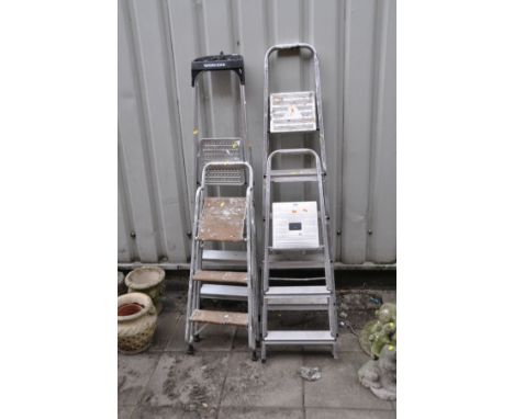 FOUR ALUMINIUM STEP LADDERS the largest being 167cm high