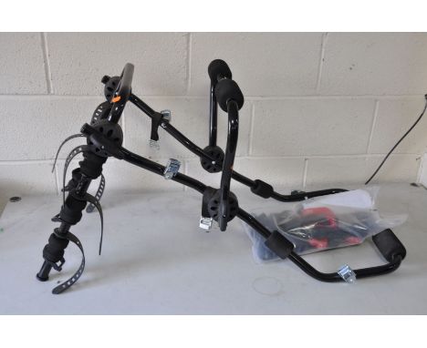 A HALFORDS REAR HIGH MOUNT BIKE CARRIER, up to three bikes, 15kg max, with straps and manual